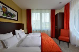 Postel nebo postele na pokoji v ubytování Aribo Hotel