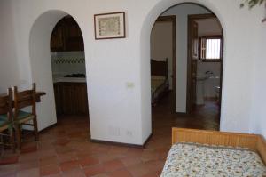 A bed or beds in a room at Dhora