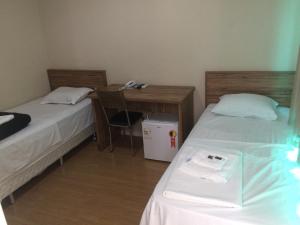 Ένα ή περισσότερα κρεβάτια σε δωμάτιο στο Hotel Campos Plaza