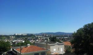 a view of a city with buildings and trees at Parada 86 Hostel in Sao Paulo