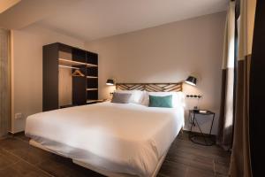 Voodi või voodid majutusasutuse Hotel Rural Sagarlore toas