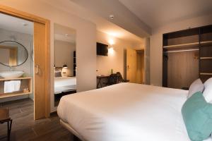 Voodi või voodid majutusasutuse Hotel Rural Sagarlore toas