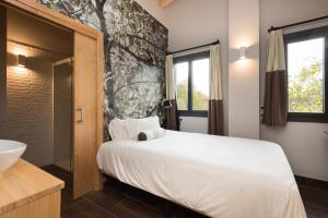 Voodi või voodid majutusasutuse Hotel Rural Sagarlore toas