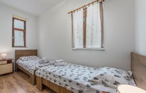 Postel nebo postele na pokoji v ubytování E-M Apartments with Private pool