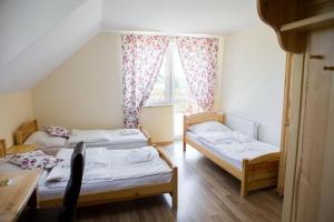Posteľ alebo postele v izbe v ubytovaní Willa Wojtasówka