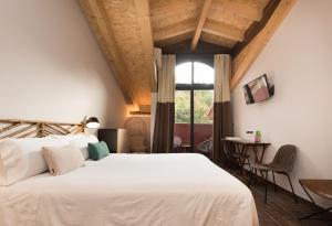 Voodi või voodid majutusasutuse Hotel Rural Sagarlore toas