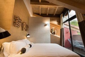 Voodi või voodid majutusasutuse Hotel Rural Sagarlore toas