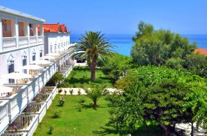 a view from the balcony of a hotel with the ocean in the background at Belussi Beach Hotel & Suites in Kypseli