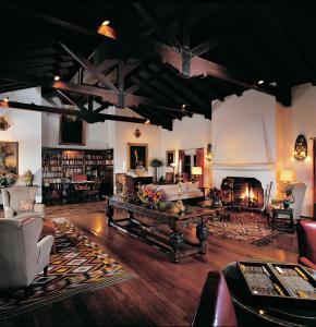 a large living room with a couch and a table at Arizona Inn in Tucson