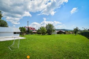 a large grassy field with a soccer ball in it at Villa Bravo Breaza in Breaza +83 photos
