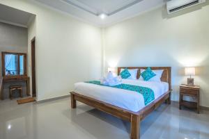Postel nebo postele na pokoji v ubytování Darba Guest House Ubud