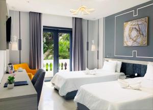 
A bed or beds in a room at Hoi An Memority Villas & Spa
