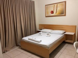 Ένα ή περισσότερα κρεβάτια σε δωμάτιο στο Acalantus Hotel