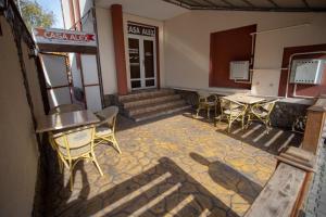 a restaurant with tables and chairs in a room at Casa Alex in Târgu Jiu