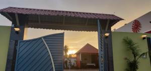 a view of a house with a blue gate at Royal stay kanchipuram in Kanchipuram