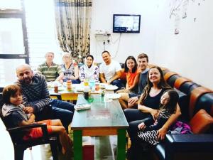 a group of people sitting in a living room at Friends Home Stay - Agra in Agra