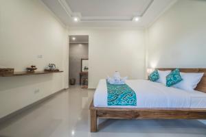 Postel nebo postele na pokoji v ubytování Darba Guest House Ubud