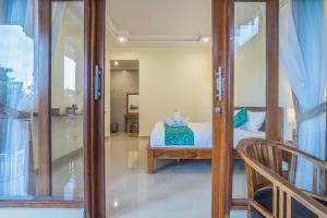Postel nebo postele na pokoji v ubytování Darba Guest House Ubud