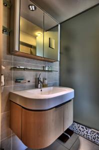 a bathroom with a sink and a mirror at Large studio eiffel tower in Paris