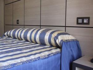 Säng eller sängar i ett rum på Hostal Larios
