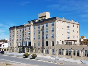a large building on the side of a street at El Aguila del Tuyu in San Clemente del Tuyú