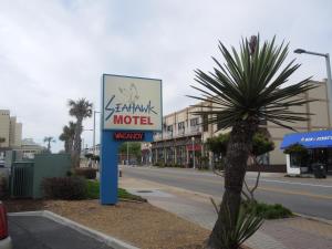 a motel sign on the side of a street at Seahawk Motel in Virginia Beach