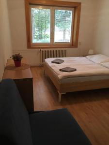 Postel nebo postele na pokoji v ubytování Holiday Park Vrchlabí - Liščí farma