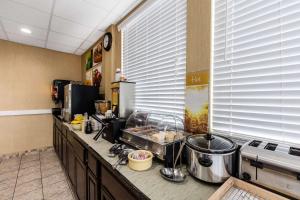 a kitchen with a counter with some food on it at Quality Inn in Tullahoma