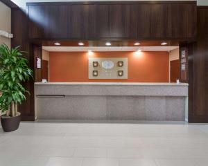 a lobby with a reception desk in a building at Comfort Suites Houston West at Clay Road in Houston