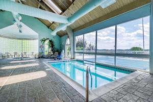 a swimming pool with a view of the water at Quality Inn London in London