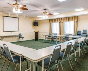 a conference room with tables and chairs and a whiteboard at Quality Inn & Suites Near Amish Country in Rushville