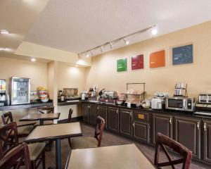 a fast food restaurant with tables and microwaves at Quality Inn Hayti North in Hayti
