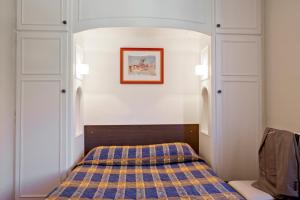 Postel nebo postele na pokoji v ubytování Hôtel et Résidence des Bains