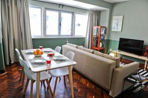 a living room with a table and a couch at To Beer or not to Beer Apartment 5A in Lisbon