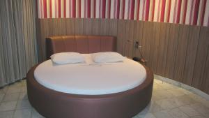 Postel nebo postele na pokoji v ubytování Motel Decameron (Adults Only)