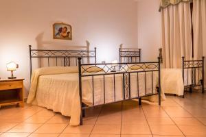 Ένα ή περισσότερα κρεβάτια σε δωμάτιο στο Tenuta Sciacca