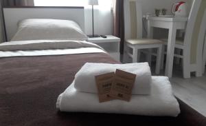Posteľ alebo postele v izbe v ubytovaní Cracow Central Aparthotel