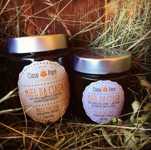 two jars of mild daze sitting in some grass at Agritur Ciasa Dò Parè in Soraga