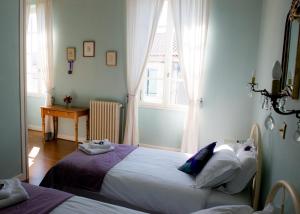 Cama ou camas em um quarto em Le Petit Cochon