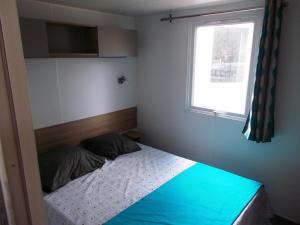 Katil atau katil-katil dalam bilik di Mobile Home 4 à 6 personnes