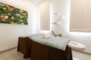 a room with a table with a towel on it at Beach View Hotel in Saint James