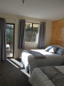 Llit o llits en una habitació de Bealey street Guesthouse