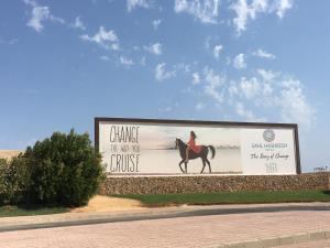 a billboard with a woman riding a horse at Azzurra two-Bedroom Apartment at Sahl Hasheesh in Hurghada