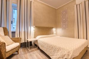 Кровать или кровати в номере Maison Castelli