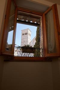 a view of a building through a window at CORE MIO in Assisi