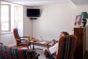 TV a/nebo společenská místnost v ubytování hôtel Piellenia