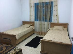 Giường trong phòng chung tại Sidi Mansour Route Touristique