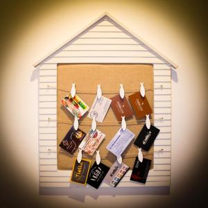 a group of food items hanging in a toy house at Le BB in Bari