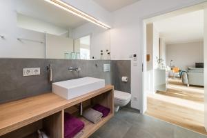 Ein Badezimmer in der Unterkunft Suites MITTE - Aparthotel