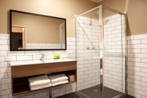 a bathroom with a sink and a mirror at Nightcap at Archer Hotel in Nowra